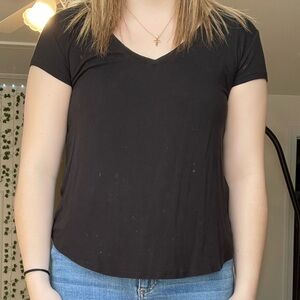 Black V-Neck T-Shirt and Blue Distressed Jeans